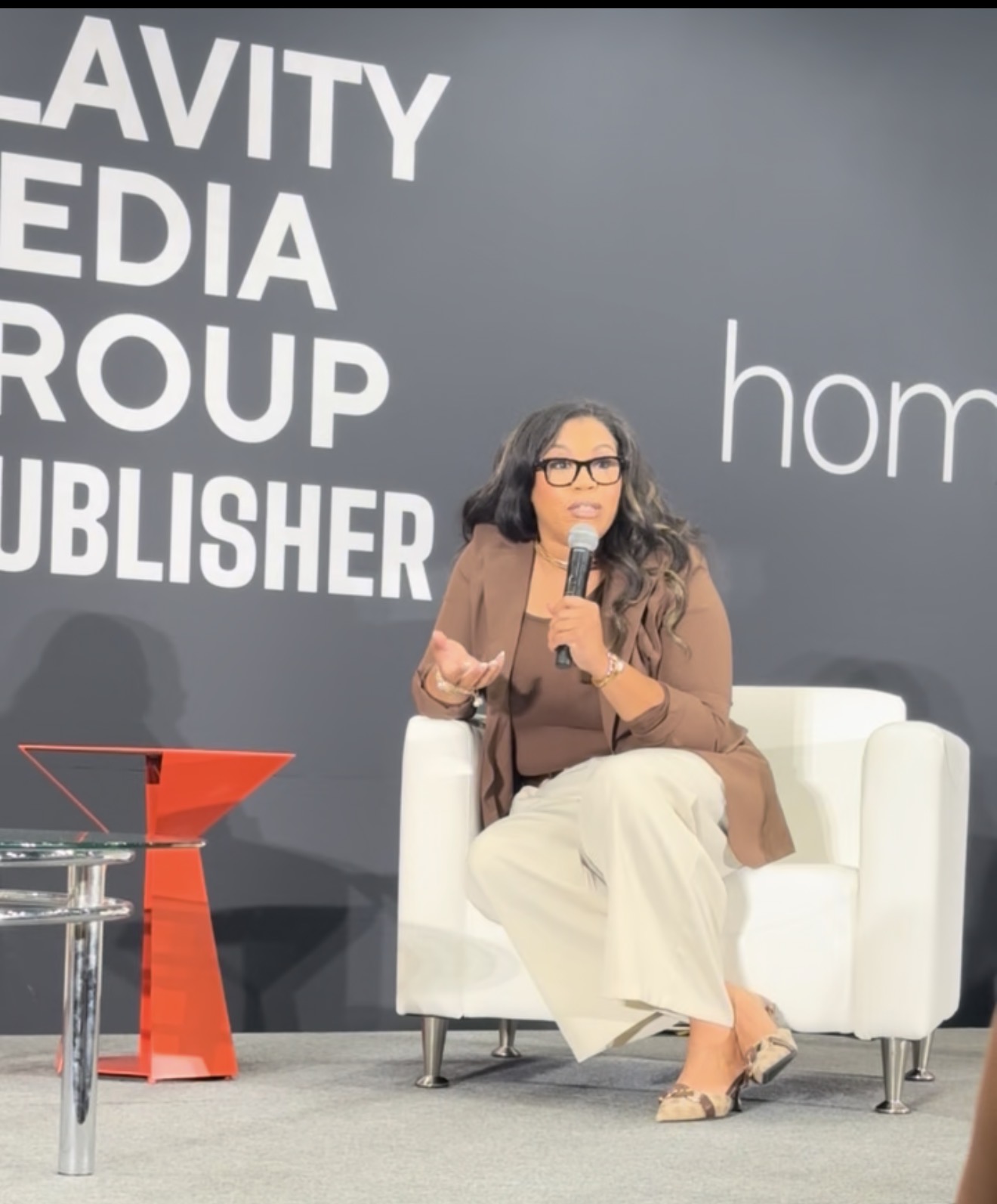 Mellie speaking on stage